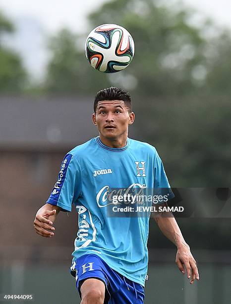 Honduras midfielder Edder Delgado plays with a ball during a practice session with his teammates in Houston, Texas, on May 31 on the eve of a World...