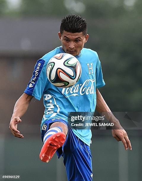 Honduras midfielder Edder Delgado plays with a ball during a practice session with his teammates in Houston, Texas, on May 31 on the eve of a World...