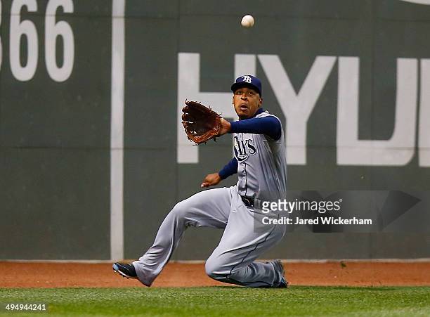 Desmond Jennings of the Tampa Bay Rays catches a fly ball in center field in the 7th inning against the Boston Red Sox during the game at Fenway Park...