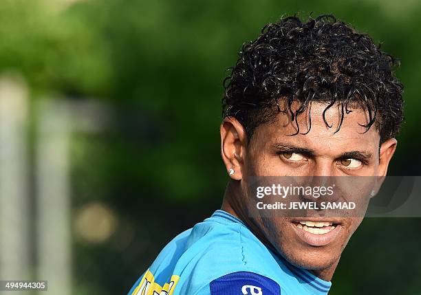 Honduras' forward Carlos Costly watches his teammates during a practice session with his teammates in Houston, Texas, on May 31 on the eve of a World...
