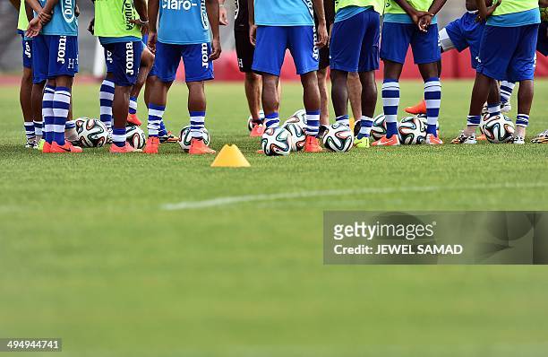 Honduras' footballers have a team meeting during a training session in Houston, Texas, on May 31 on the eve of a World Cup preparation match against...