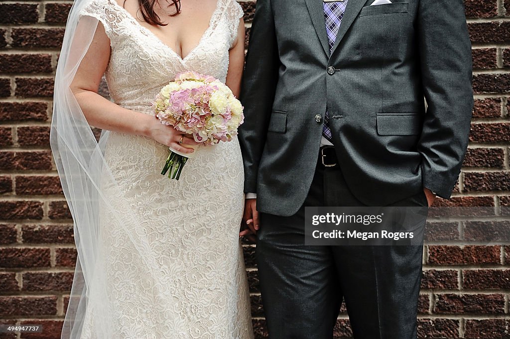 Bride and groom with bouquet of flowers