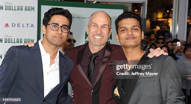 Actor Suraj Sharma, director Craig Gillespie and actor Madhur Mittal arrive at the Los Angeles premiere of 'Million Dollar Arm' at the El Capitan...