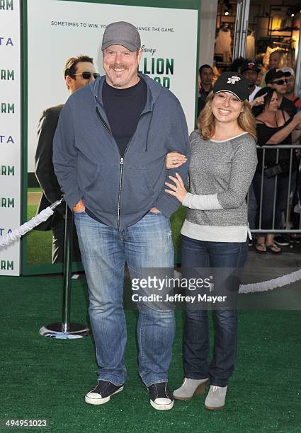 Actor John DiMaggio and Kate Miller arrive at the Los Angeles premiere of 'Million Dollar Arm' at the El Capitan Theatre on May 6, 2014 in Hollywood,...