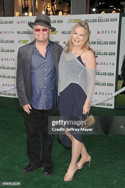 Musician/actor Micky Dolenz and Donna Quinter arrive at the Los Angeles premiere of 'Million Dollar Arm' at the El Capitan Theatre on May 6, 2014 in...