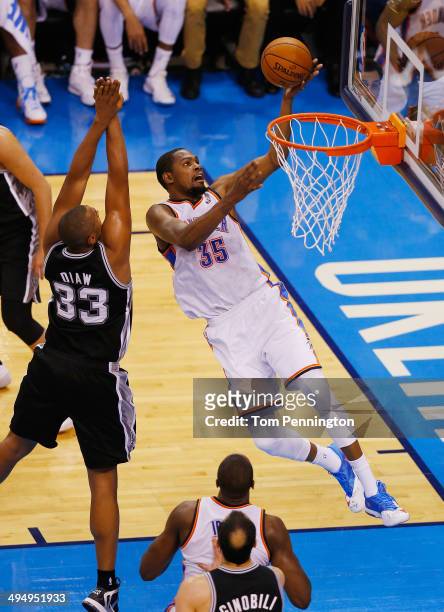 Kevin Durant of the Oklahoma City Thunder shoots over Boris Diaw of the San Antonio Spurs in the second half during Game Six of the Western...