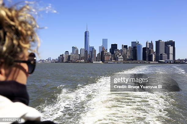 view of skyline of lower manhattan from a ferry - staten island ferry bildbanksfoton och bilder