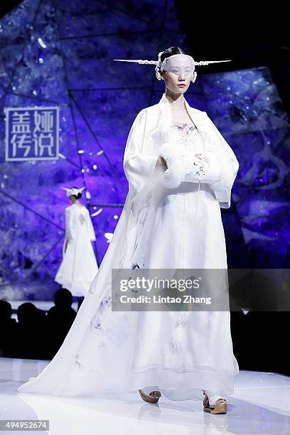 Model showcases designs on the runway at Heaven Gaia Xiong Ying High Fashion Collection show during the Mercedes-Benz China Fashion Week...