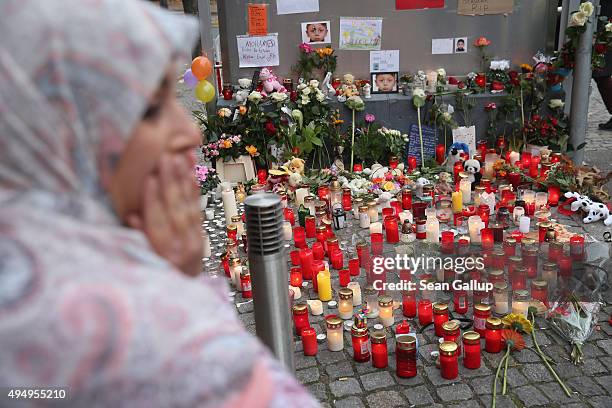 Woman stands at a makeshift memorial to four-year-old Mohamed Januzi near the site where he was abducted several weeks ago on October 30, 2015 in...