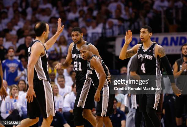 Manu Ginobili and Danny Green of the San Antonio Spurs celebrate with their teammates after a play against the Oklahoma City Thunder in the second...