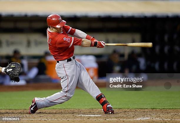 Collin Cowgill of the Los Angeles Angels of Anaheim hits a three-run home run in the fourth inning against the Oakland Athletics at O.co Coliseum on...