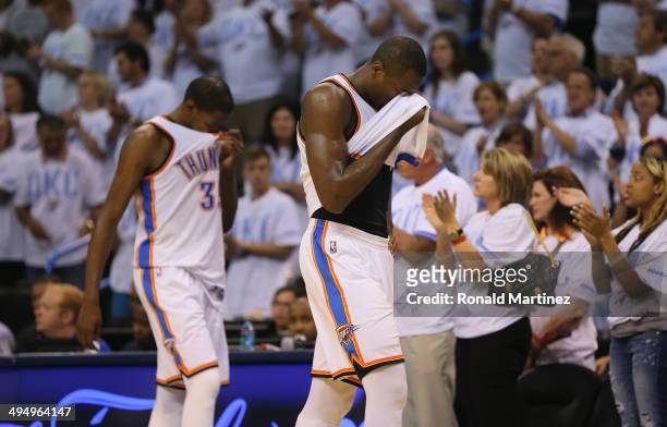 Kevin Durant and Serge Ibaka of the Oklahoma City Thunder walk off the court after the San Antonio Spurs defeated the Thunder 112-107 in overtime...