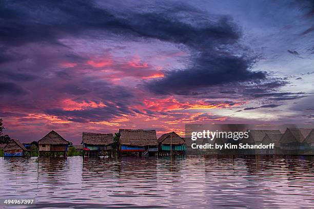 sunset over the village - iquitos fotografías e imágenes de stock