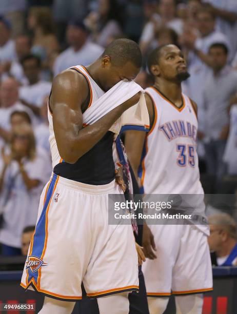 Kevin Durant and Serge Ibaka of the Oklahoma City Thunder walk off the court after the San Antonio Spurs defeated the Thunder 112-107 in overtime...
