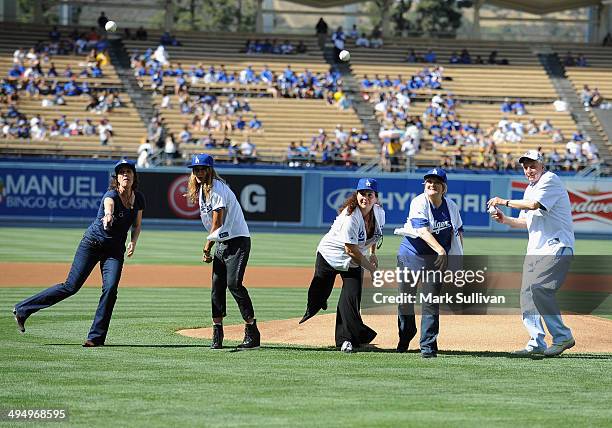Cast members from film "A League of Their Own" Patti Pelton, Anne Ramsay, Tracy Reiner, Megan Cavanagh and Garry Marshalll throw out the ceremonial...