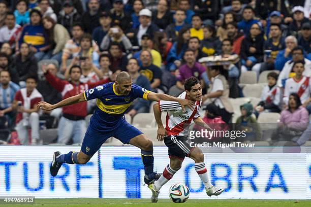 Daniel Diaz of Boca fights fouls Keko Villaloba of River during a friendly match between Boca Juniors and River Plate at Azteca Stadium on May 31,...