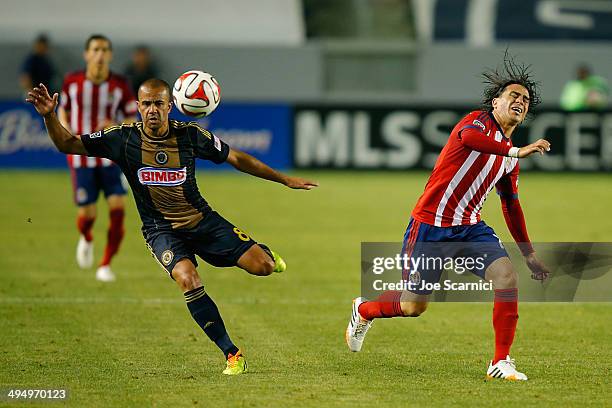 Fred Da Silva of Philadelphia Union moves the ball past Mauro Rosales of Chivas USA in the second half at StubHub Center on May 31, 2014 in Los...