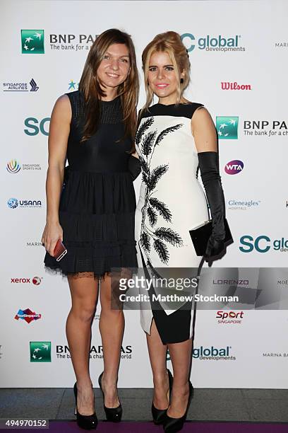 Simona Halep and Paloma Faith attend Singapore Tennis Evening at Marina Bay Sands on October 30, 2015 in Singapore.