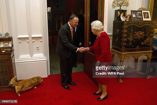 Queen Elizabeth II greets Prime Minister of New Zealand John Key at a audience held at Windsor Castle on October 29, 2015 in Windsor, England.