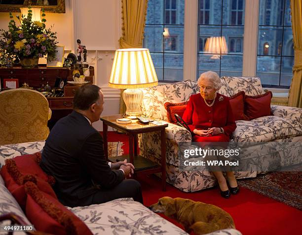 Queen Elizabeth II speaks with Prime Minister of New Zealand John Key at a audience held at Windsor Castle on October 29, 2015 in Windsor, England.