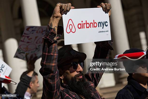 Supporters of Airbnb hold a rally on the steps of New York City Hall showing support for the company on October 30, 2015 in New York City. The New...