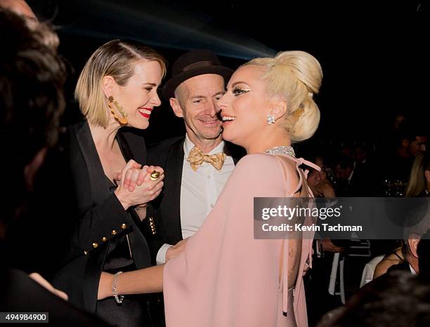Actors Sarah Paulson, Denis O'Hare, and musician Lady Gaga attend the amfAR Inspiration Gala at Milk Studios on October 29, 2015 in Hollywood,...