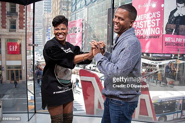 Calloway interviews Ta'Rhonda Jones during her visit to "Extra" at their New York studios at H&M in Times Square on October 30, 2015 in New York City.