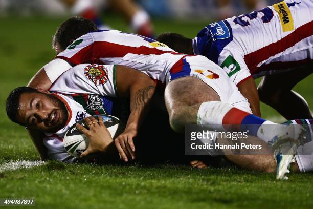 Feleti Mateo of the Warriors is brought down during the round 12 NRL match between the New Zealand Warriors and the Newcastle Knights at Mt Smart...