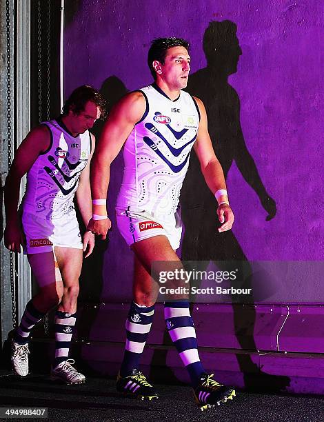 Matthew Pavlich leads the Dockers onto the ground during the round 11 AFL match between the Western Bulldogs and the Fremantle Dockers at Etihad...