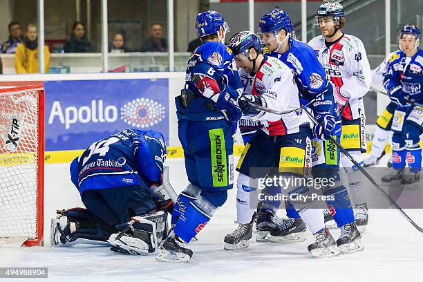 Dustin Strahlmeier, Sebastian Osterloh of Straubing Tigers, Mark Olver of the Eisbaeren Berlin and Sandro Schoenberger of Straubing Tigers during the...