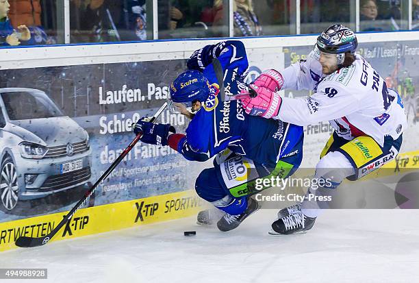 Sebastian Osterloh of Straubing Tigers and Julian Talbot of the Eisbaeren Berlin during the game between the Straubing Tigers and the Eisbaeren...