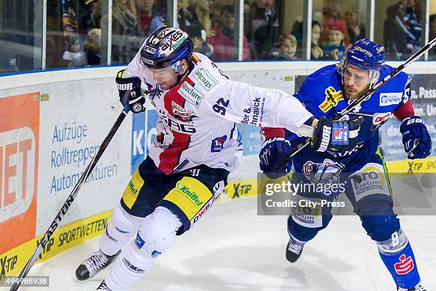 Marcel Noebels of the Eisbaeren Berlin and Sebastian Osterloh of Straubing Tigers during the game between the Straubing Tigers and the Eisbaeren...