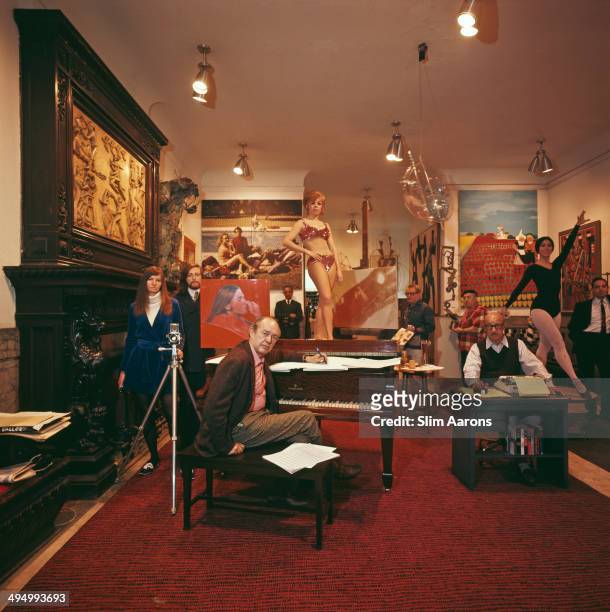 Artistic denizens gather in the lobby of the Chelsea Hotel on W. 23rd Street, Manhattan, New York City, 1968. Clockwise from left, photographer Sandy...