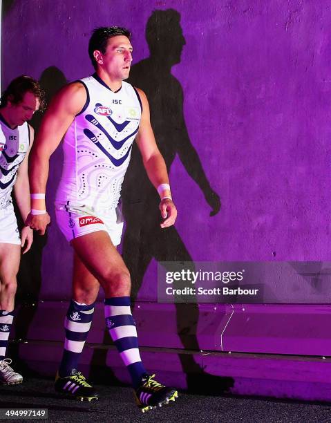 Matthew Pavlich leads the Dockers onto the ground during the round 11 AFL match between the Western Bulldogs and the Fremantle Dockers at Etihad...