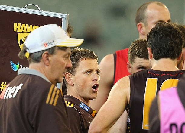 Brendon Bolton the coach of the Hawks talks to his players during the round 11 AFL match between the Hawthorn Hawks and the Greater Western Sydney...