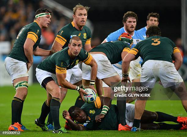 South Africa's scrum half Ruan Pienaar passes the ball during the bronze medal match of the 2015 Rugby World Cup between South Africa and Argentina...