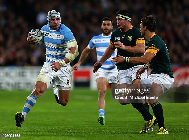 Juan Manuel Leguizamon of Argentina is faced by Francois Louw and Handre Pollard of South Africa during the 2015 Rugby World Cup Bronze Final match...