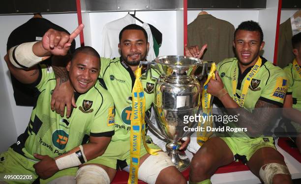 Salesi Ma'afu, Samu Manoa and Courtney Lawes of Northampton celebrate after their victory during the Aviva Premiership Final between Saracens and...