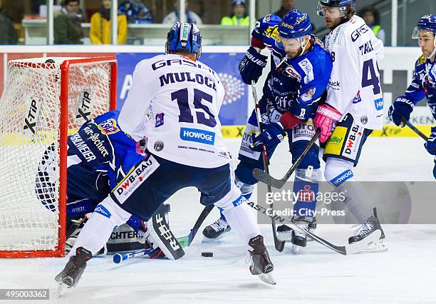 Dustin Strahlmeier of Straubing Tigers, T.J. Mulock of the Eisbaeren Berlin, Sebastian Osterloh of Straubing Tigers and Julian Talbot of the...