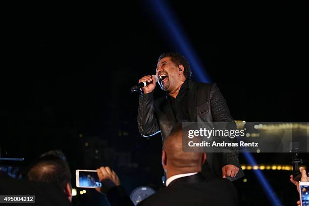 Cheb Khaled performs live at the Gala event during the Vogue Fashion Dubai Experience 2015 at Armani Hotel Dubai on October 30, 2015 in Dubai, United...