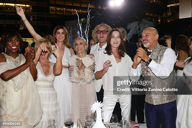 Ertharin Cousine, Alberta Ferretti, Bianca Brandolini d'Adda, Franca Sozzani, Peter Dundas, Carla Bruni and Christian Louboutin dance at the Gala...