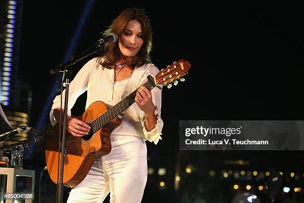 Carla Bruni performs live at the Gala event during the Vogue Fashion Dubai Experience 2015 at Armani Hotel Dubai on October 30, 2015 in Dubai, United...