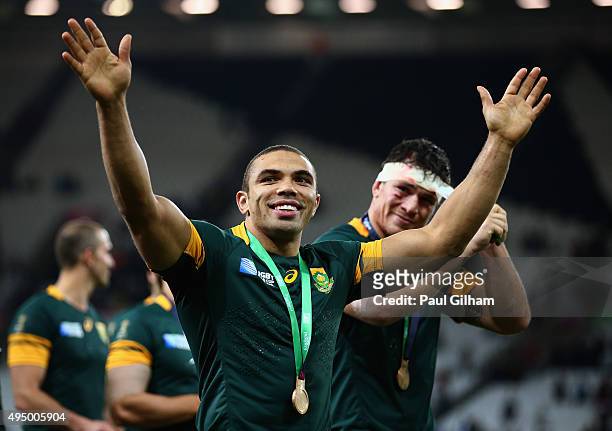 Bryan Habana of South Africa and team mates salute the crowd after victory in the 2015 Rugby World Cup Bronze Final match between South Africa and...