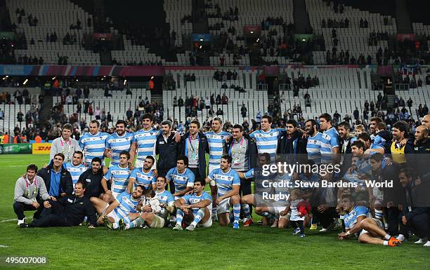 Argentina players and staff pose after the 2015 Rugby World Cup Bronze Final match between South Africa and Argentina at the Olympic Stadium on...