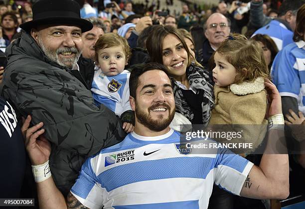 Argentina's wing Horacio Agulla poses with fans after losing the bronze medal match of the 2015 Rugby World Cup between South Africa and Argentina at...