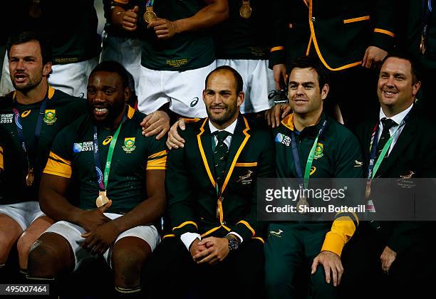 Fourie Du Preez of South Africa poses with team mates after the 2015 Rugby World Cup Bronze Final match between South Africa and Argentina at the...