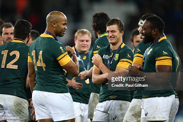 Pietersen , Handre Pollard and Tendai Mtawarira of South Africa in discussion after the 2015 Rugby World Cup Bronze Final match between South Africa...
