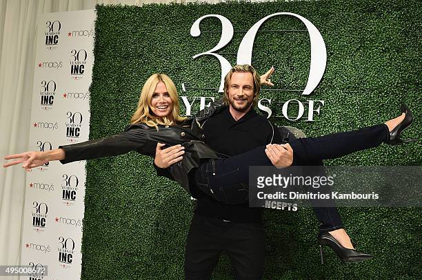 Heidi Klum and Gabriel Aubry attend the Glamour and INC International Concepts Denim Dash with Heidi Klum at Herald Square on October 30, 2015 in New...