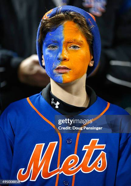 Young fan of the New York Mets is looks on prior to Game Three of the 2015 World Series between the New York Mets and the Kansas City Royals at Citi...