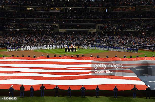 Giant American Flag is displayed on the field prior to Game Three of the 2015 World Series at Citi Field between the New York Mets and the Kansas...